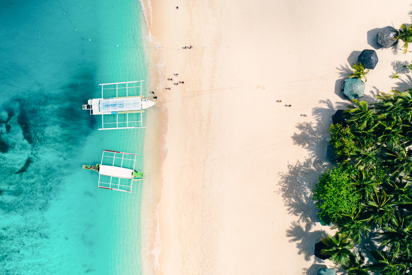 Daku island view from the sky. Man relaxing taking sunbath on the beach.shot taken with drone above the beautiful scene. concept about travel, nature, and marine landscapes