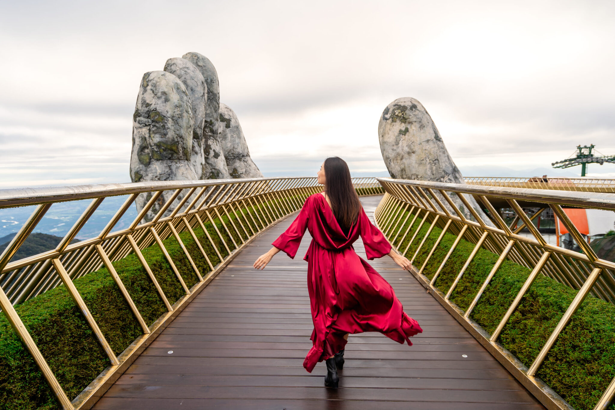 young-woman-traveler-in-red-dress-enjoying-at-gold-2026-03-19-22-07-09-utc