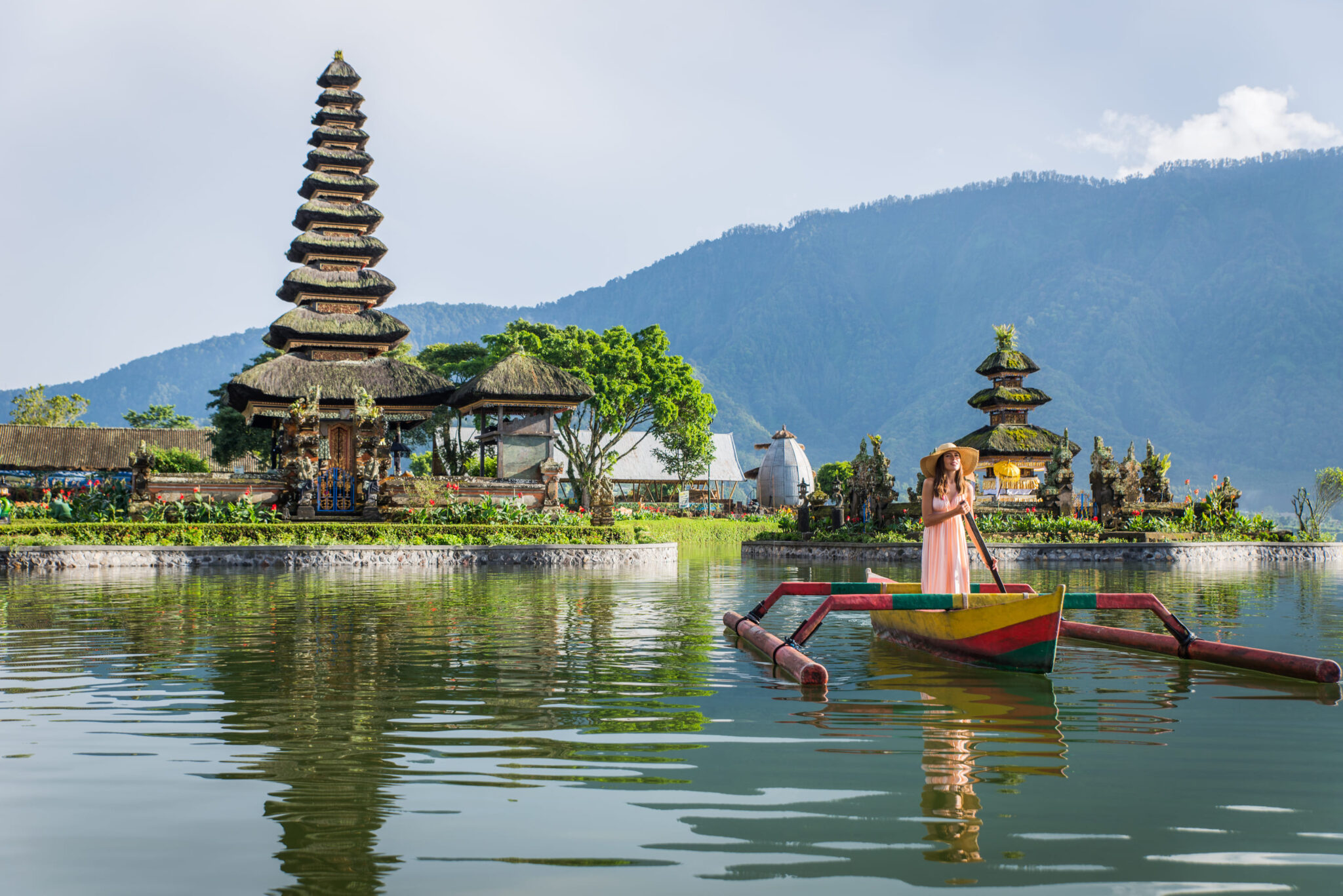 young-woman-traveler-paddling-on-a-wooden-boat-at-2026-01-08-07-42-42-utc